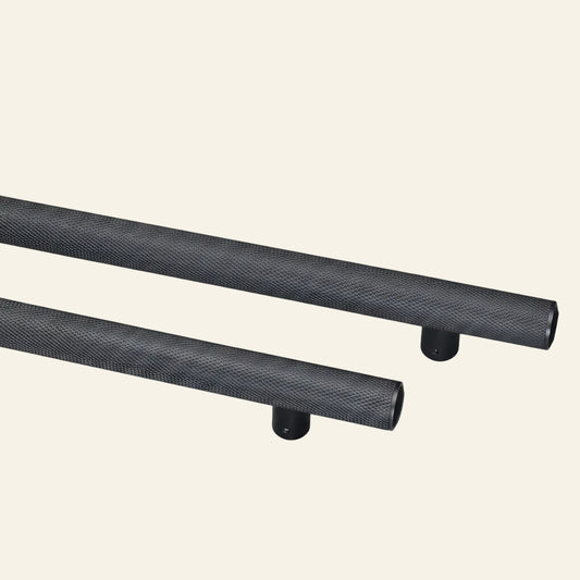 Two solid brass pull handles with a black finish and textured grips, displayed vertically on a grey background, with the brand name 'AceLine' visible at the top.