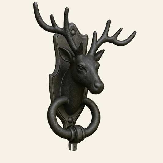 Elk-shaped solid brass door knocker on a wooden door with AceLine branding.