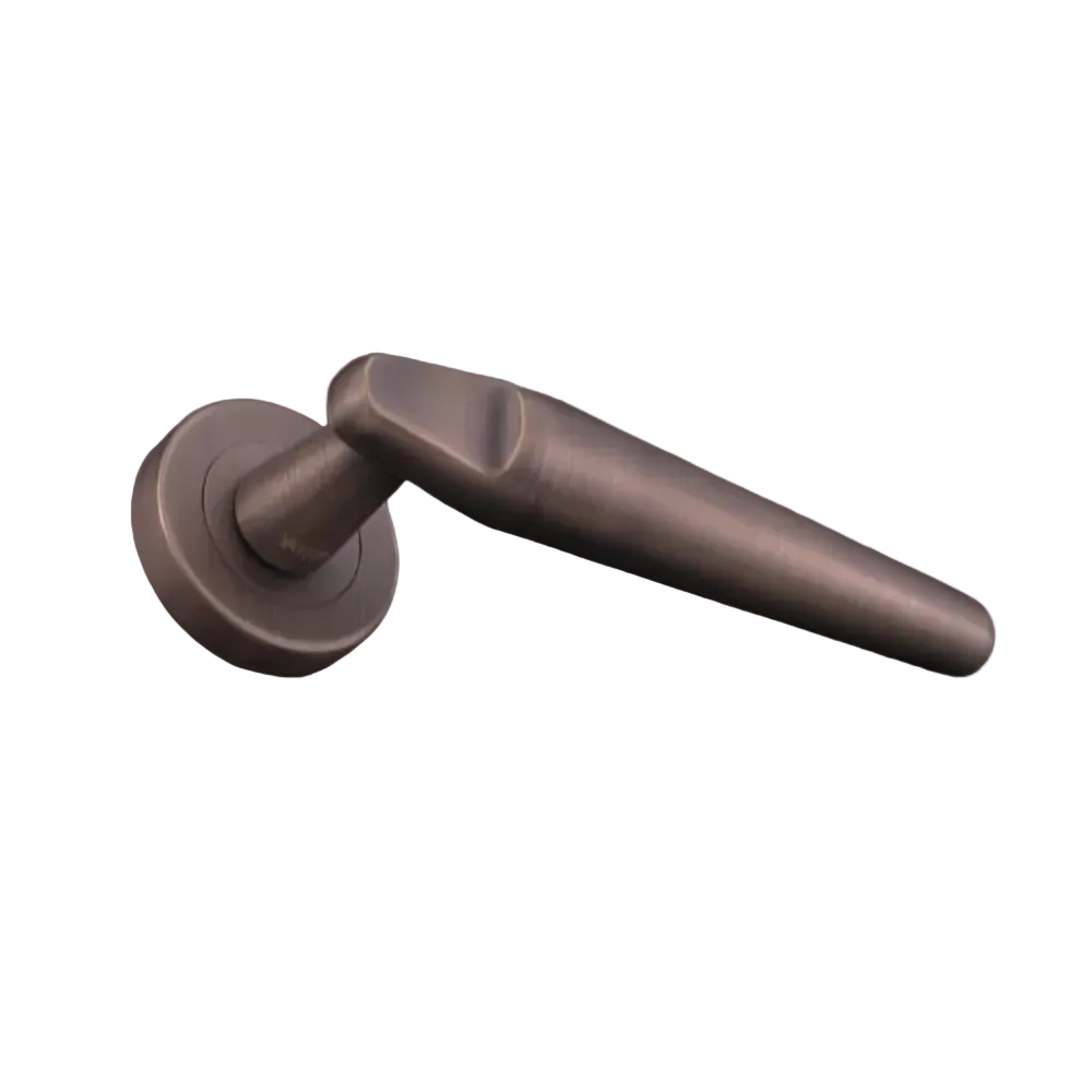 Bronze door handle on a dark background