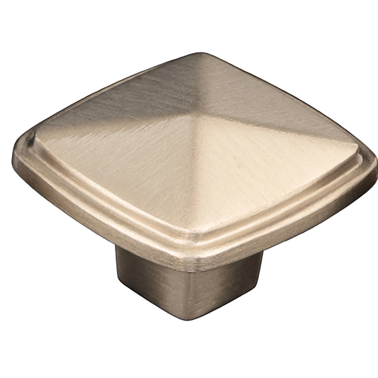 A square pyramid-shaped cabinet knob with a brushed satin finish, shown on a reflective black background.