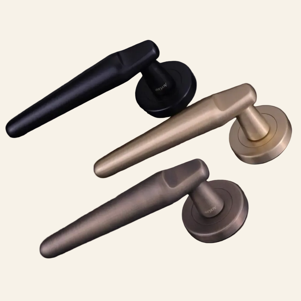 Three door handles in black, gold, and bronze on a dark background