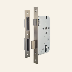 Metal door lock mechanism on a white background