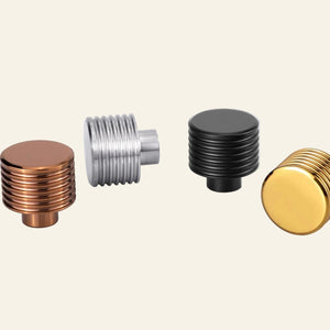 AceLine collection of stainless steel furniture knobs in various finishes including natural, PVD, satin, and gold, with the brand 'aha!' prominently displayed.