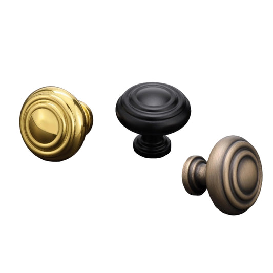 Three door knobs in polished brass, powder-coated black, and English bronze on a dark background with AceLine branding.